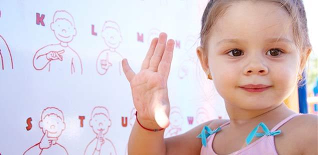 Little-girl-using-sign-language.jpg#asset:2827