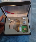 A device looking like a hearing aid in the package named hearing amplifier
